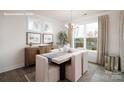 Elegant dining room with natural light, modern table setting, and sophisticated decor elements at 2066 Skyhawk Dr, York, SC 29745