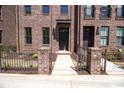 Stunning brick townhome showcasing a walkway, and classic architectural elements at 226 Gilead Rd, Huntersville, NC 28078
