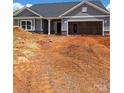 New home featuring gray siding, a two-car garage, and a covered front entrance at 230 Mountain Island Dr # 39, Statesville, NC 28677