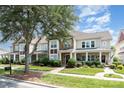 Street view of townhomes with manicured lawns, sidewalks, and inviting curb appeal at 2324 Bonterra Blvd, Indian Trail, NC 28079