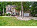 Beautiful two-story home featuring a brick facade, well-manicured lawn, and mature landscaping at 2426 Tory Oak Pl, Matthews, NC 28105
