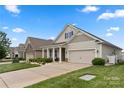 Beautiful home with manicured lawn, inviting curb appeal, and an attached two car garage in a desirable location at 274 Robinwood Ln, Lake Wylie, SC 29710