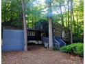 Unique home featuring a combination of stone and siding, surrounded by mature trees at 2800 Patio Ln, Gastonia, NC 28056
