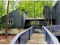 Charming home with wood siding and a connecting wooden walkway for easy access at 2800 Patio Ln, Gastonia, NC 28056