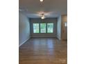 Bright, spacious living room with hardwood floors and large windows offering abundant natural light at 2910 Sloan Dr, Charlotte, NC 28208