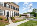 Brick townhome displaying well-maintained landscaping and a front yard at 309 N Aspen St, Lincolnton, NC 28092
