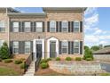 Brick townhome featuring well-maintained landscaping and a front yard at 309 N Aspen St, Lincolnton, NC 28092