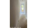 Hallway featuring freshly painted walls and an exterior door at the end at 312 Wesley Heights Way # B, Charlotte, NC 28208