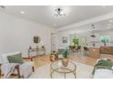 Inviting living room with hardwood floors, modern lighting, and open concept floor plan flowing into the kitchen and dining areas at 3478 Winters St, Newton, NC 28658