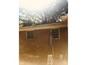 View of brick house, patio furniture and umbrella in backyard at 3715 Vanderburg Dr, Concord, NC 28025