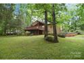 Inviting home with a spacious backyard, mature trees, and a charming deck, perfect for outdoor entertaining at 6227 Dogwood Ln, Waxhaw, NC 28173