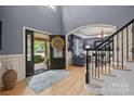 Elegant foyer showcases hardwood floors, an open floor plan, and a stunning view into the formal living room at 9021 Unbridle Ln, Waxhaw, NC 28173