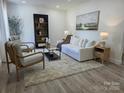 Bright living room featuring modern decor, neutral colors, hardwood floors, and natural light at 1015 4Th St, Spencer, NC 28159