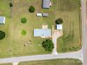 Aerial view of a well-maintained property featuring a home, detached garage, and expansive green lawn at 1107 Richard Rd, Salisbury, NC 28147