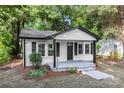 Charming home featuring white siding, black trim, and a welcoming front porch at 1155 Cedar Grove Ln, Rock Hill, SC 29732