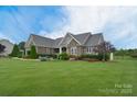 Landscaped front yard of beautiful home at 11772 Sugar Hill Rd, Davidson, NC 28036