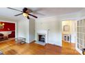 Inviting living room with hardwood floors, fireplace, and decorative accents, offering a warm and comfortable atmosphere at 118 Marshdale Sw Ave, Concord, NC 28025