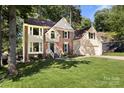 Beautiful home with brick and siding, a well-kept lawn, and an attached two-car garage at 12602 Angel Oak Dr, Huntersville, NC 28078