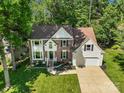Charming brick and siding home featuring a manicured lawn and a two-car attached garage at 12602 Angel Oak Dr, Huntersville, NC 28078