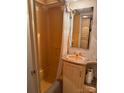RV bathroom featuring a shower, toilet and vanity at 148 Trivette Trl, Mount Gilead, NC 27306