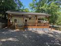 Exterior of RV with covered porch, deck and stone skirting around the base at 148 Trivette Trl, Mount Gilead, NC 27306