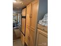 RV interior with cabinetry and a refrigerator at 148 Trivette Trl, Mount Gilead, NC 27306