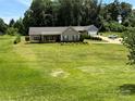 Beautiful view of a home with a well-maintained lawn and an attached garage at 190 Watering Trough Rd, Statesville, NC 28677