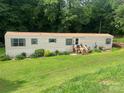 Well-maintained single-story home with landscaped front yard and quaint entrance at 2165 Peanuts Ln, Newton, NC 28658