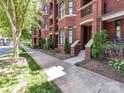 Brick condo building with inviting entrances and landscaped front yards at 2810 Selwyn Ave # 104, Charlotte, NC 28209