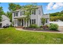 Charming two-story home with a manicured lawn and inviting curb appeal at 314 Sunnywood Ln, Charlotte, NC 28270