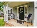 Inviting front porch featuring a 'Welcome' mat and comfortable seating at 314 Sunnywood Ln, Charlotte, NC 28270