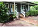 Inviting front porch with rocking chairs and brick walkway adding character and charm at 344 Lucas Rd, Star, NC 27356