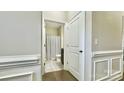 Hallway view into a bathroom with tiled floors and a shower-tub combo at 3735 Norman View Dr, Sherrills Ford, NC 28673