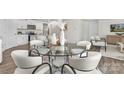 Bright dining area featuring a glass table and seating for six guests at 1053 Horizon Ln, Chester, SC 29706