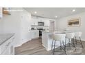 Modern kitchen features white cabinets, granite countertops and stainless steel appliances at 1053 Horizon Ln, Chester, SC 29706