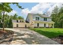 Charming two-story home featuring an attached garage and well-manicured lawn at 127 Wickersham Dr, Statesville, NC 28625