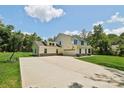 Beautiful two-story home with an attached garage, long driveway and well-manicured lawn at 127 Wickersham Dr, Statesville, NC 28625