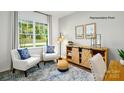 Comfortable living room with large window, stylish furnishings, and decorative accents that add charm at 138 Rustling Waters Dr, Mooresville, NC 28117