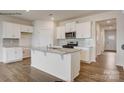 Bright kitchen with white cabinetry, granite countertops, and stainless steel appliances at 150 Parker Claire Ln, Kings Mountain, NC 28086