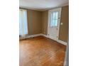 Cozy living room showcasing beautiful hardwood floors at 1510 Stoker Ter, Albemarle, NC 28001