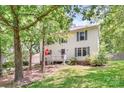 Two-story home with lawn surrounded by mature trees at 1739 Lesa Lin Dr, Monroe, NC 28112