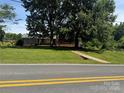 Brick home with large trees in the front yard at 1821 Beaman St, Shelby, NC 28152