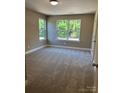 Bright, carpeted bedroom with plenty of natural light and neutral paint at 183 Pine Haven Rd, Statesville, NC 28677