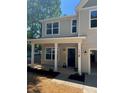 Inviting front porch featuring stately white columns and charming outdoor lighting at 183 Pine Haven Rd, Statesville, NC 28677