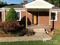 Detailed front of a brick home with a covered porch and updated siding at 2357 28Th Ne St, Hickory, NC 28601