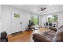 Bright living room showcasing hardwood floors, a TV area, and views of the outdoors at 2536 Bancroft St, Charlotte, NC 28206