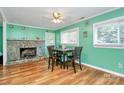 Cozy dining room with stone fireplace, hardwood floors, and ample natural light at 2601 Marldale St, Gastonia, NC 28052