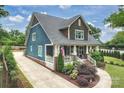 Beautiful two-story home with a long driveway and well-manicured lawn and landscaping at 2829 Holt St, Charlotte, NC 28205