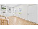 Bright living room with built-in shelving, hardwood floors, and natural light pouring in through the windows at 3110 Streamside Dr, Davidson, NC 28036