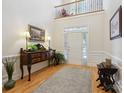 Light and airy foyer featuring hardwood floors, console table, and a soaring ceiling at 3128 Ethereal Ln, Charlotte, NC 28226